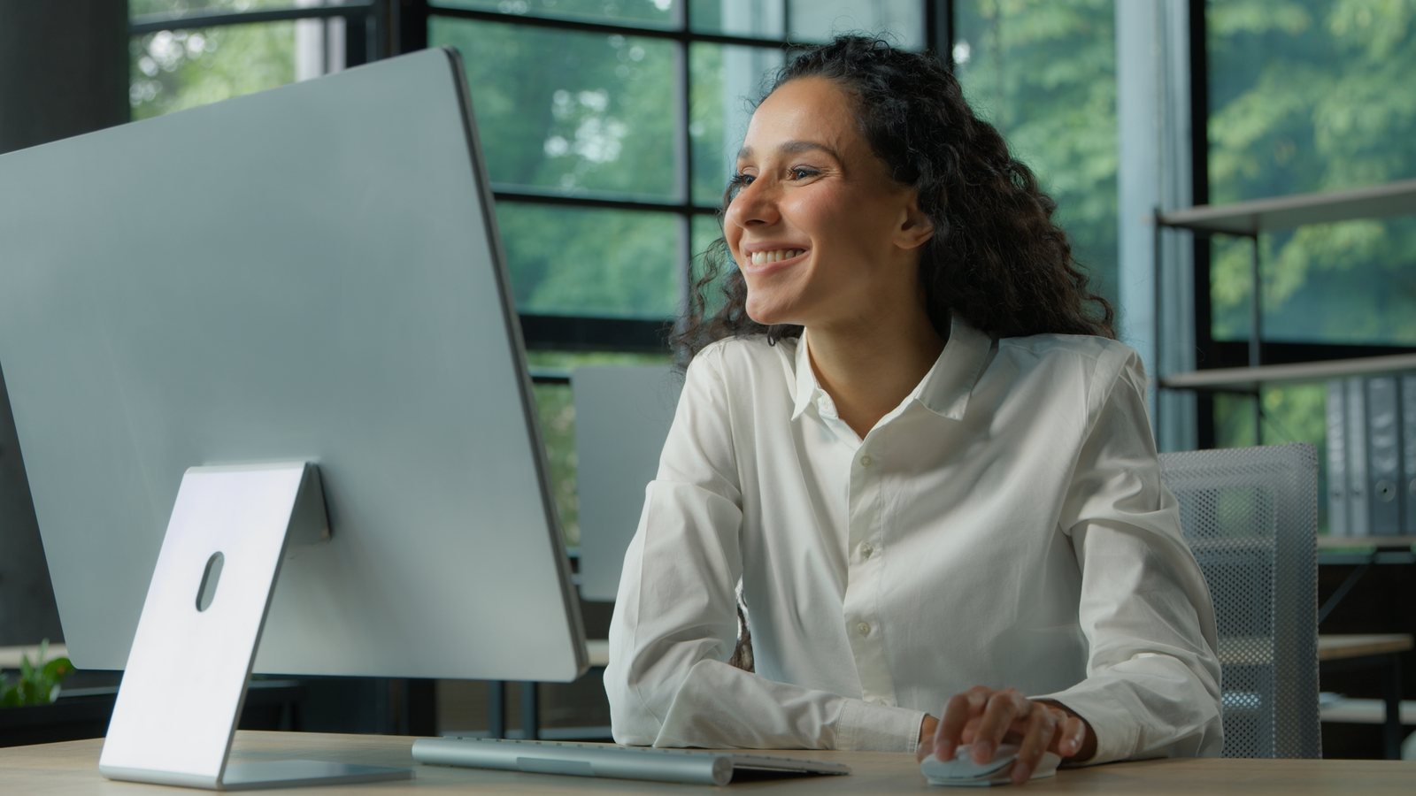 Operations leader working at a desktop computer