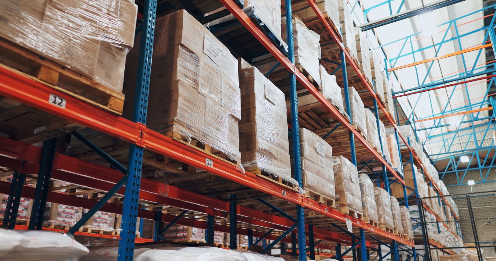 Warehouse aisle with stocked pallets