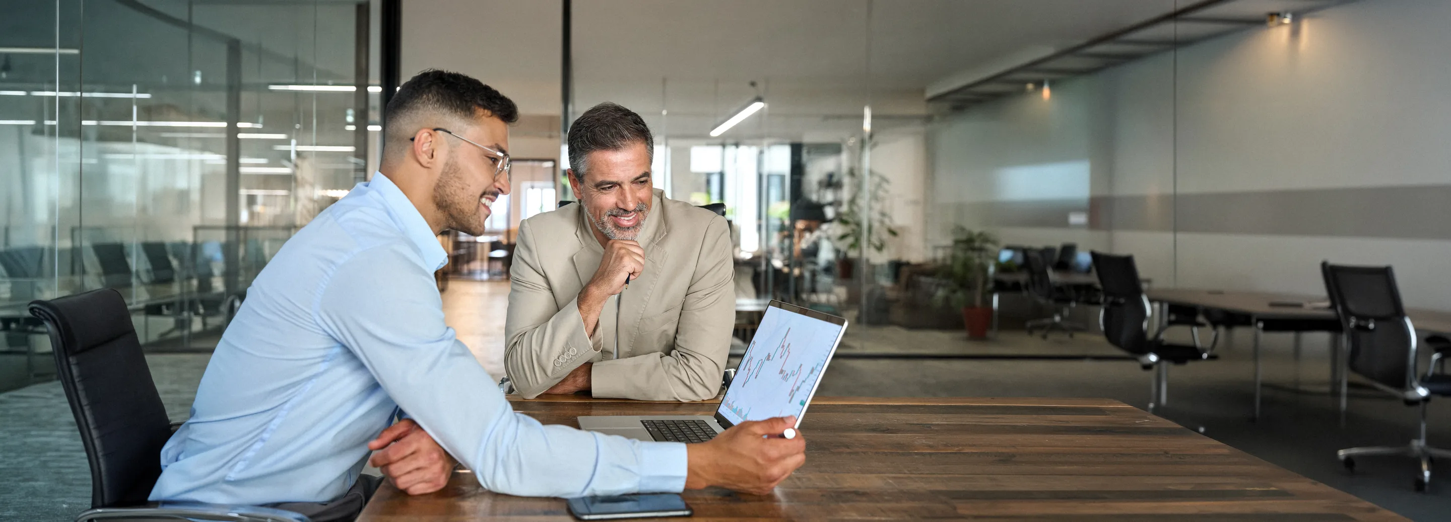 Manager reviewing predictive insights on a laptop